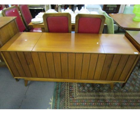 A mid 20th century Zenith stereo record player cabinet with louvre doors, hinged top with fitted interior, on tapering, squar