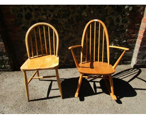 An Ercol Windsor standard chair, six plain spindle back, elliptical H stretchers, gold and blue Ercol label and stamped initi