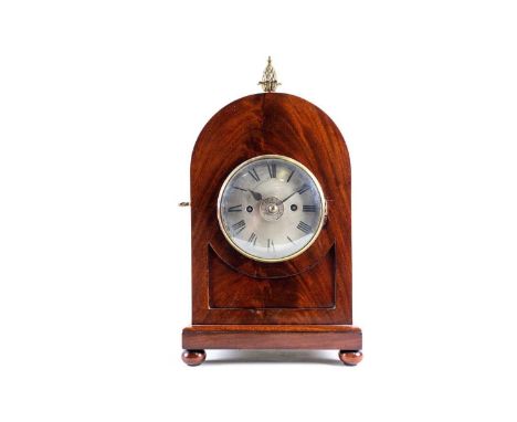 A George III period mahogany cased mantle clock with gilt surmount and pineapple finial. The circular dial movement with twin