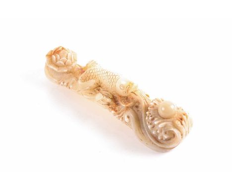 A Chinese carved white jade figure of an auspicious fish with a pearl and head of lotus.22 cm longCondition report: No appare