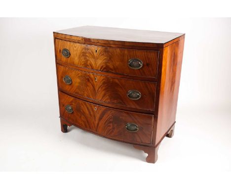A reconfigured 19th-century mahogany caddy topped bowfront chest of three long drawers. Supported on shaped bracket feet. 81 