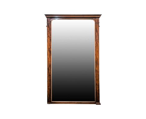 A large and impressive Victorian mahogany framed overmantle mirror of architectural form. With moulded cornice and a pair of 
