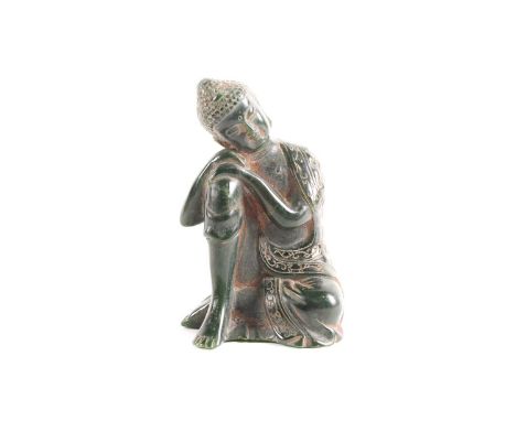 A Chinese carved "Spinach" jade figure of the resting Budha. Seated with head upon his knee. 13 cm high x 8.1 cm wide x 7.5 c