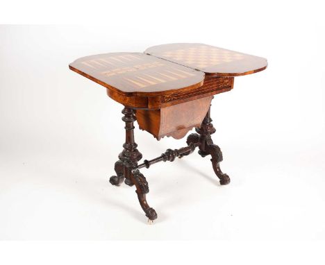 A Victorian marquetry and parquetry inlaid and figured walnut rectangular gaming/ work table combination. The top swivelling 