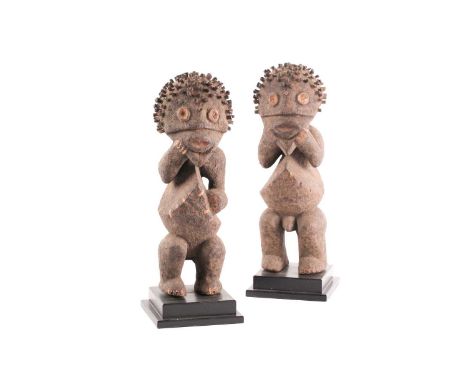 Mambila standing male and female figures, Tadep, Cameroon/Nigeria, each encrusted in a thick pigment throughout, the eyes, mo