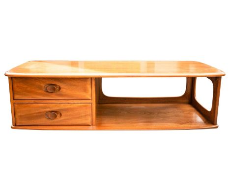 An Ercol golden dawn light elm lozenge form coffee table fitted two short drawers. 125 cm long x 53 cm wide x 40 cm highFootn