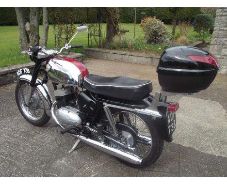 A 1964 Royal Enfield Turbo Twin, registration number ADF 73B, frame number 68820-965, engine number 701E 965, red and chrome.