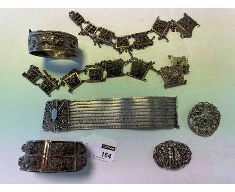 An Eastern panel necklace (a/f), a Burmese bracelet, a Chinese bangle, a filigree mesh bracelet, and two brooches (6)