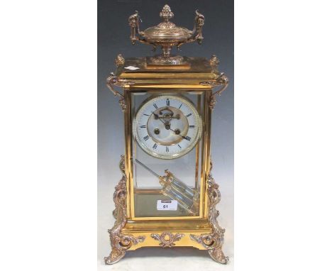 A 20th-century silver-plated four-glass mantel clock with French bell striking movement, visible Brocot escapement and mercur