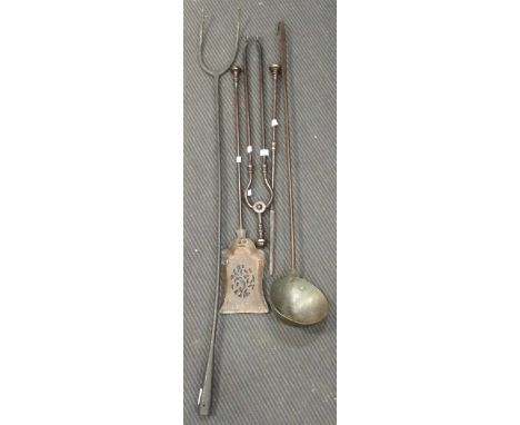 Steel fire irons including a two-pronged pitchfork and large hand wrought ladle