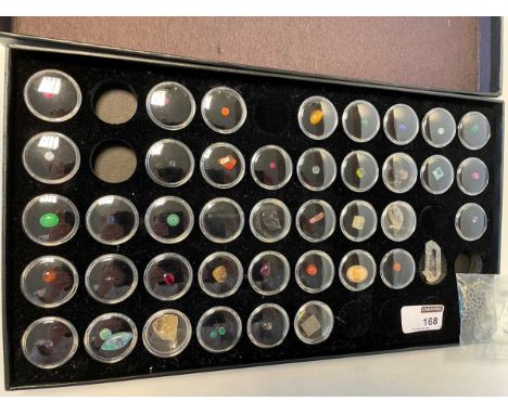 A collection of assorted gemstones and crystals, including an Ethiopian opal and a star ruby