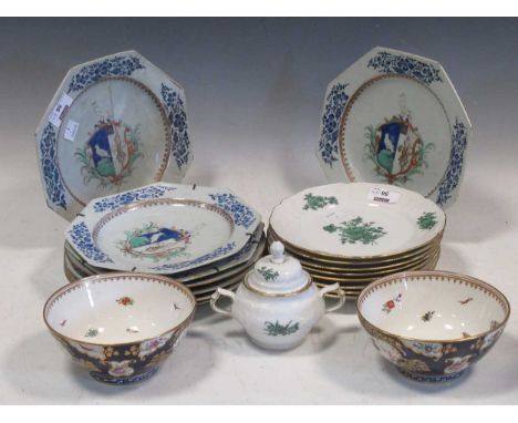 A set of eight octagonal and circular armorial plates, the rims with blue foliate decoration, one a/f, 23cm diameter; togethe