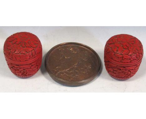 A pair of Chinese lacquer pots with foliate decoration together with a 19th century bronze medallion of a putto