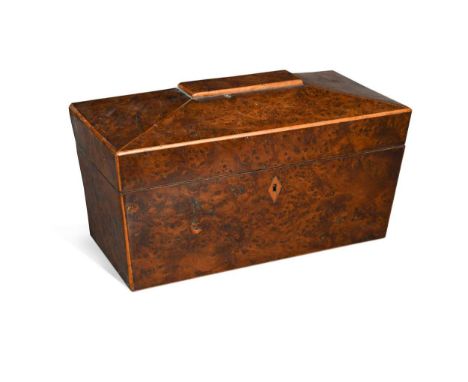 A Regency burr yew wood sarcophagus tea caddy, with boxwood stringing, and fitted with a pair of removable caddies and later 