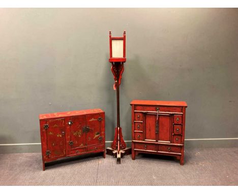 A red lacquered cabinet with three doors and two drawers decorated with figures and horses 69 x 84 x 24cm, together with anot