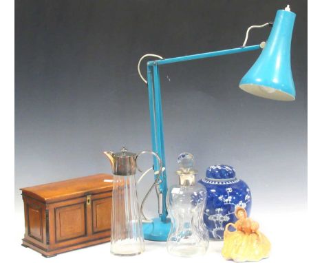 A silver neck glass decanter, a tea caddy of miniature chest form, claret jug, pair of decanters, angle lamp, a Royal Doulton