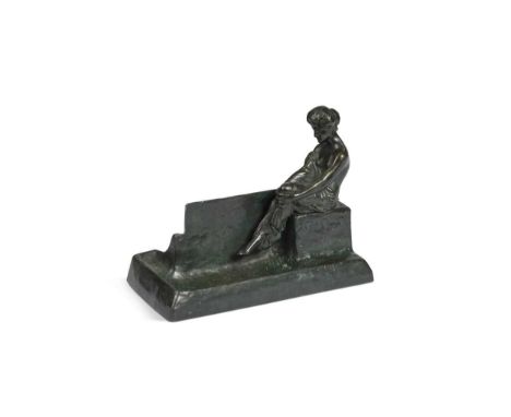 A small Art Nouveau patinated bronze pin tray, modelled with a woman seated in profile upon a ledge12 x 15 x 7.5cm