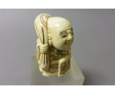Signed Oxbone Netsuke of a Travelling Buddha