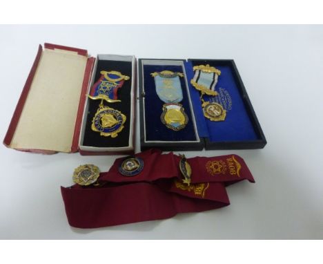 Two Cased Gilt and Enamel Masonic Medals with Ribbons together with another uncased plus Gilt & Enamel Masonic Medal on Sash