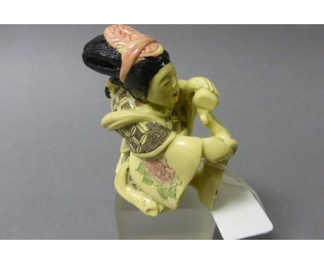 Oriental figure of a Lady playing Harp