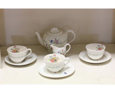 Royal Staffordshire Ceramics by Clarice Cliff Part Tea Service comprising Tea Pot, Milk Jug, Three Cups, Two Saucers and a Te