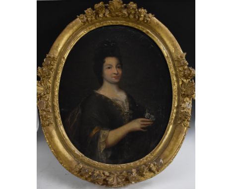 French School (c.1680)Portrait of a Lady, half length, holding a flower posyoil on canvas, oval, 81cm x 63cm