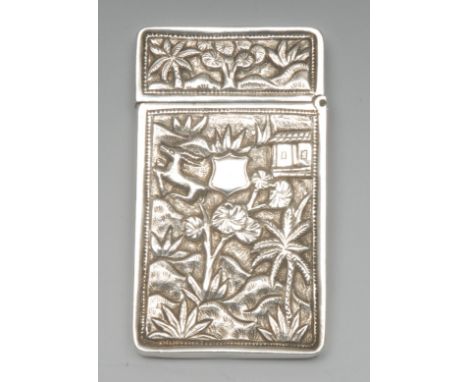 A Chinese silver rectangular visiting card case, chased with temples and deer amongst trees, hinged cover, 8.5cm long, c.1870