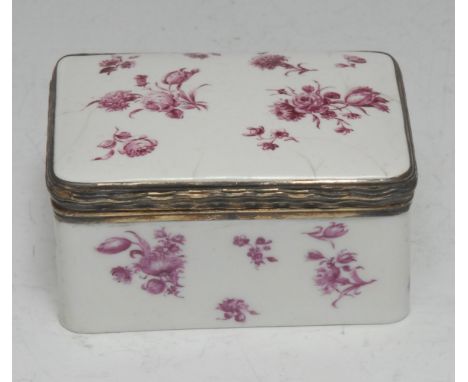 An 18th century rounded rectangular enamel table snuff box, sparsely painted en puce camaïeu with Indianische blumen, gilt-me