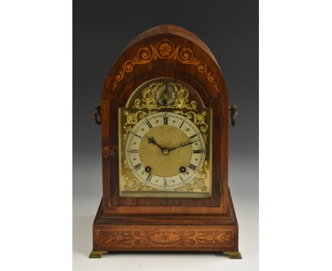 An Edwardian mahogany and marquetry lancet bracket clock, 13cm silvered chapter ring inscribed with Roman numerals, surmounte