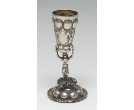 A Renaissance Revival silver figural cup, conical bowl and domed circular base chased with domed 'cabochons', gilt interior, 