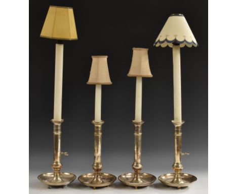 A set of four silver plated adjustable candlesticks, now converted to table lamps, dished bases, 25.5cm high, early 20th cent