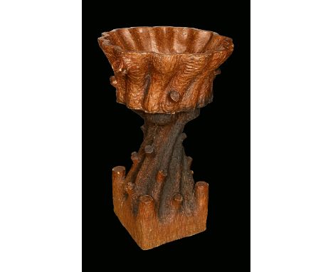 A 19th century saltglazed stoneware garden planter, naturalistically modelled as a tree trunk, 54cm wide; a campana urn, simi
