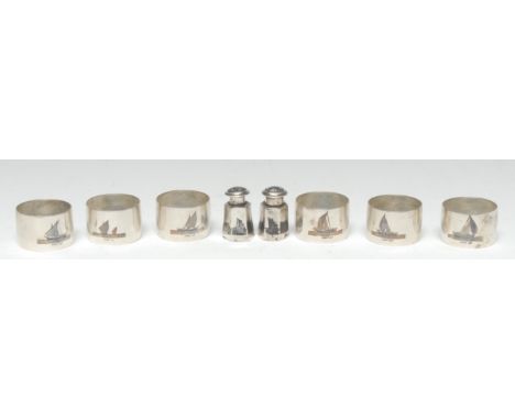 A set of six Middle Eastern silver and niello napkin rings, 4cm diam; a pair of peppers, similar (8), 6.5oz