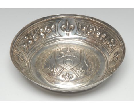 A 19th century French silver circular wine taster, the domed field chased with municipal arms and fleur-de-lys, 15.5cm diam, 