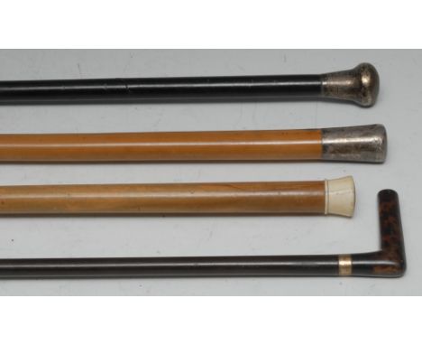 A George V silver mounted gentleman's walking stick, the domed pommel engraved with scrolling foliage, ebonised shaft, the ca