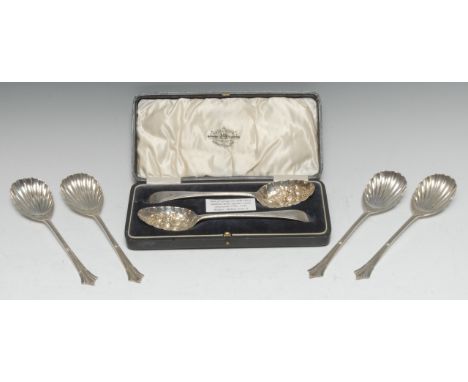 A pair of George III provincial silver Old English pattern 'berry' spoons, Robert Scott II, Newcastle c.1800; a set of four G