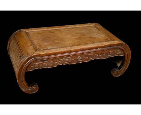 A Chinese hardwood low tea table, rectangular panel top above a deep frieze carved with trellis, scroll end supports, 33cm hi