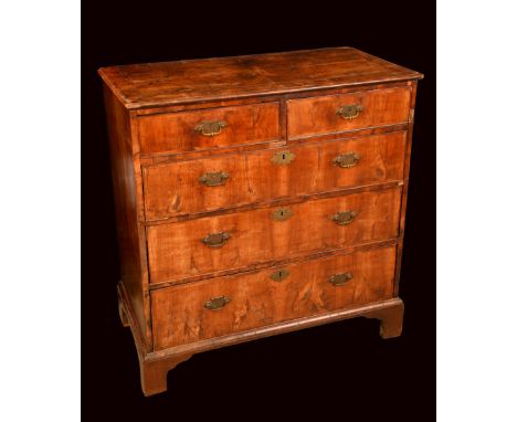 A George I/II walnut chest, crossbanded quarter-veneered top above two short and three long graduated cockbeaded drawers, eng