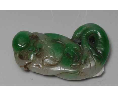 A Chinese two-tone jade amulet, of a Shou-Lao as a merman, the stone in tones of emerald and celadon green, 6cm long 