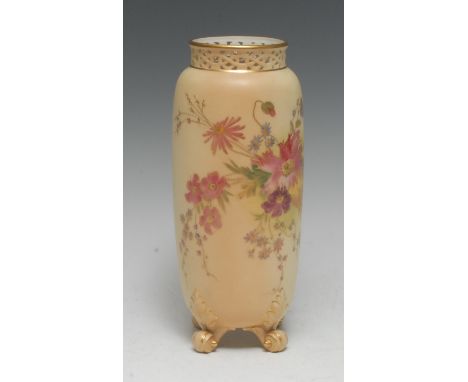 A Royal Worcester cylindrical vase, pierced neck, printed and  painted with flowers on a blush ivory ground, gilt scroll feet