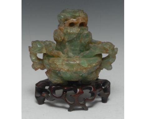A Chinese jade green quartz twin-handled censer and cover, carved in the Archaic taste with ferocious beasts and stylized fol
