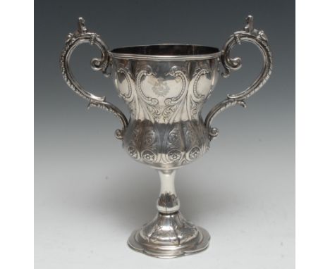 A 19th century Anglo-Indian silver inverted ogee pedestal military  presentation cup, engraved with the insignia and battle h