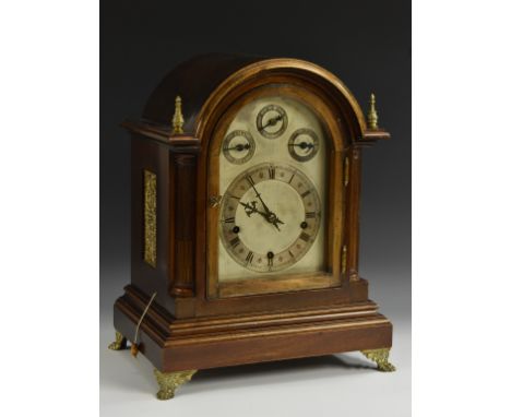 An early 20th century mahogany bracket clock, 16cm silvered chapter ring with Roman  numerals , the arch with three subsidiar