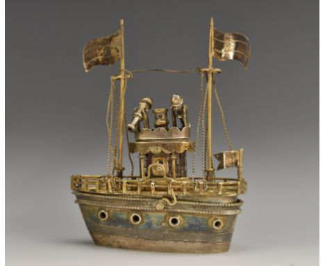 A silver coloured metal nef, as a battle ship, with masts, flags and canons, the hull containing a compartment, the lift-off 