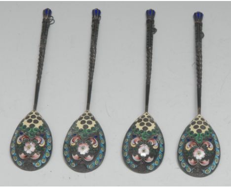 A set of four Russian silver and cloisonne enamel spoons, each gilt bowl decorated to verso with flowers and scrolling foliag
