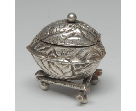 A Victorian silver novelty mustard, as a walnut, hinged cover, triform branch base, ball feet, 5.5cm long, maker AER, London 
