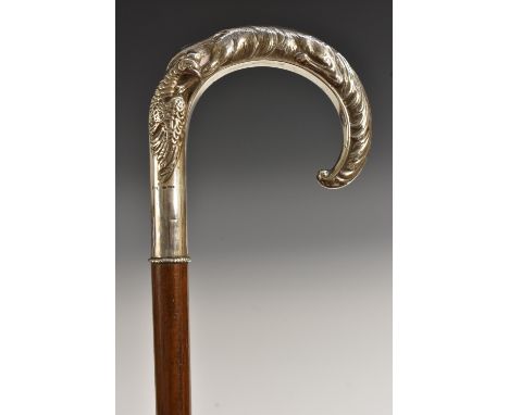 A Continental silver mounted gentleman's novelty walking stick, the curved handle embossed with a fox carrying off a game bir