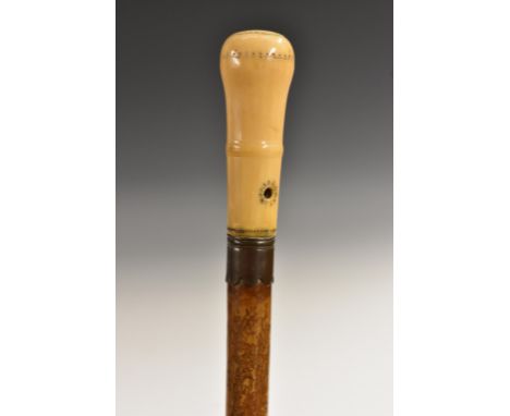 A Queen Anne gentleman's ivory, 'piqué' and malacca walking stick, turned domed handle with traces of silver piqué and centre