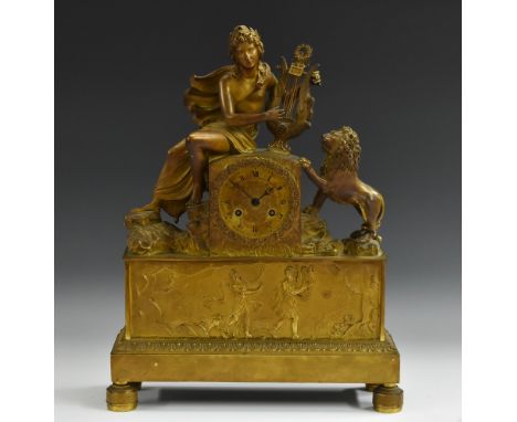 A French Empire ormolu clock, 8cm engine-turned dial inscribed with Roman numerals and centred by twin-winding holes, 8-day m