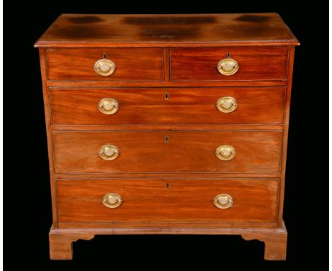 A 19th century mahogany chest, moulded top above two short and three long graduated cockbeaded drawers, oval brass handles, s